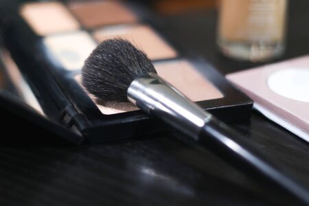 Using a makeup brush with a pallete / Contouring / makeup paletteの写真素材
