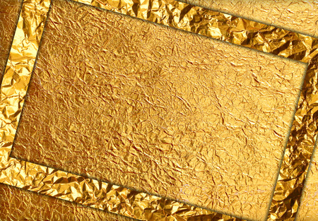 Shiny yellow leaf gold foil texture backgroundの写真素材