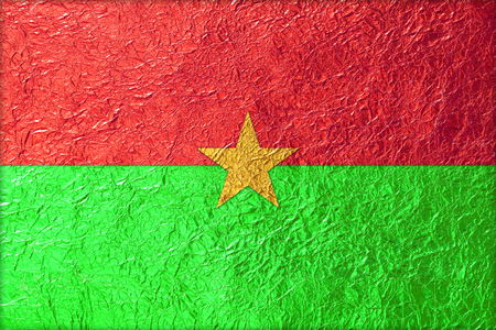 Burkina Faso Flag with a Shiny  leaf  Bronze Shiny  leaf   foil texture backgroundの写真素材