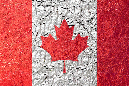 Canada Flag with a Shiny  leaf  Bronze Shiny  leaf   foil texture backgroundの写真素材