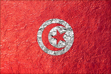 Tunisia Flag with a Shiny  leaf  Bronze Shiny  leaf   foil texture backgroundの写真素材