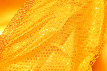 Shiny yellow leaf gold foil texture backgroundの写真素材