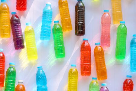 colorful water in bottles for background.の写真素材