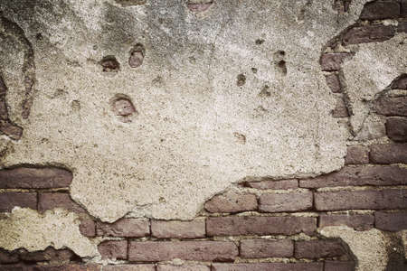 cracked concrete vintage brick wall backgroundの写真素材