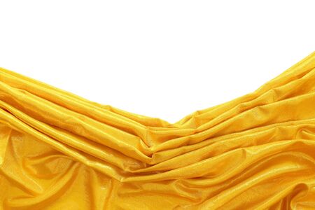 gold silk fabric on white backgroundの写真素材