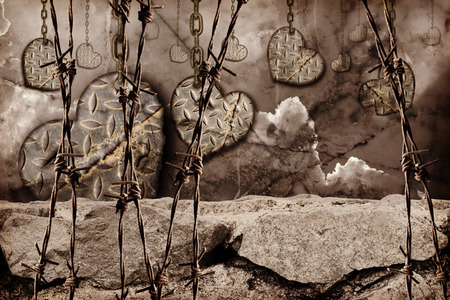 dark toned background hearts of steel with scratches hanging on chainsの写真素材
