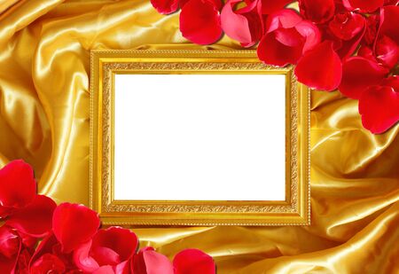 Gold frame on fabric silk with roses petalの写真素材