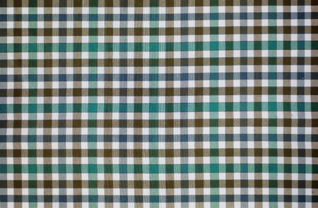 Tartan plaid natural cotton fabric. Seamless tiles texture for the background