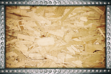 Plywood texture with metal rivets frame