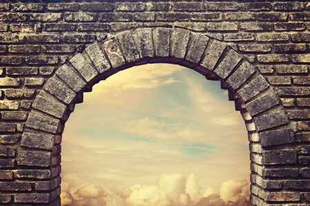 Background sky looking through an old brick window.の写真素材