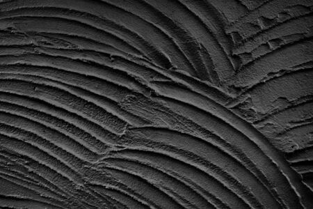 Decorative black structural plaster on wallの写真素材