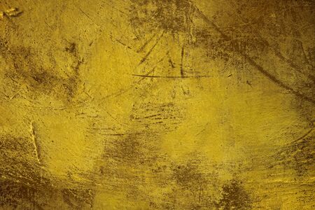Old dark gold grunge with scratched textureの写真素材