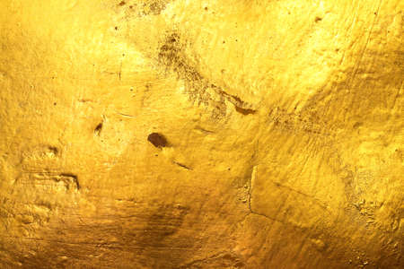 Scratched and damaged old gold background