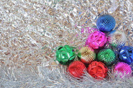 Colorful decoration balls on silver background. Minimal concept. Chrismas eve or new year idea.の写真素材