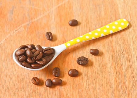 Coffee beans on a spoonの写真素材