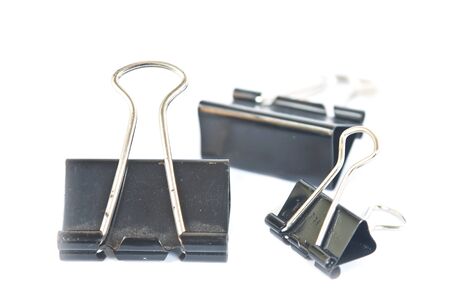 Black Paper clip isolated on white background.の写真素材