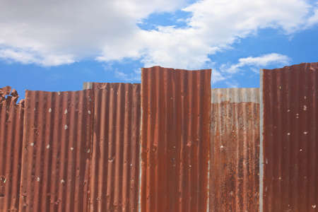 Rusty corrugated metal wallの写真素材