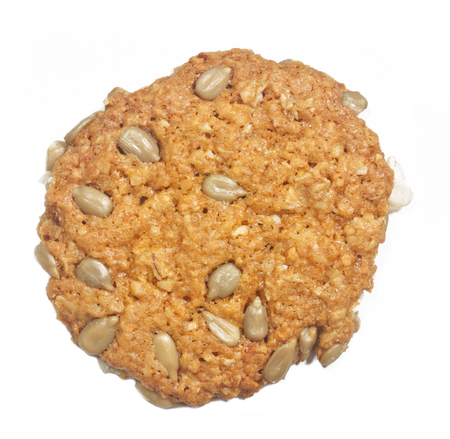 Cookies from sunflower seeds and chocolate on a white backgroundの写真素材