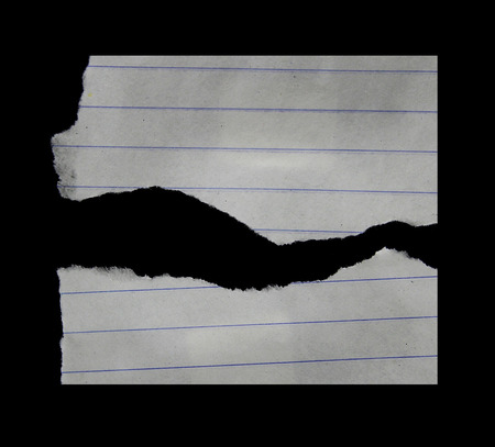 Ripped black and white paper, copy spaceの写真素材