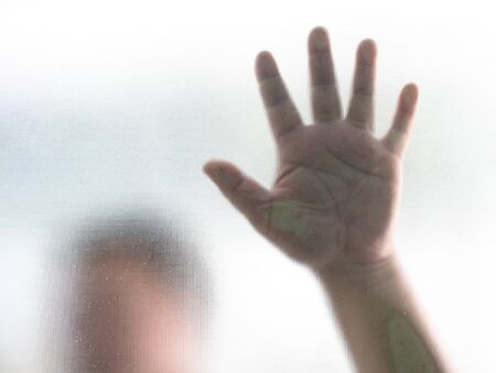 Human finger on glass backgroundの写真素材