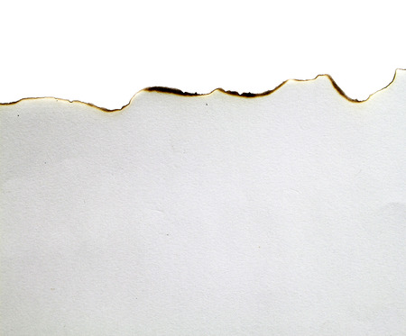 close up of a white ripped piece of paper on white backgroundの写真素材