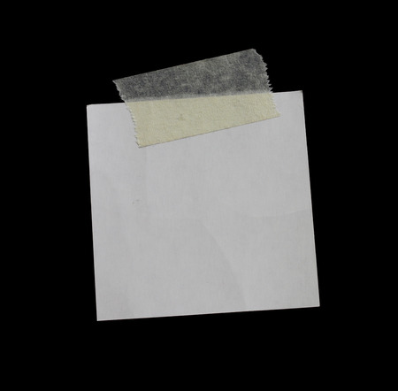 Torn pieces of paper on black backgroundの写真素材