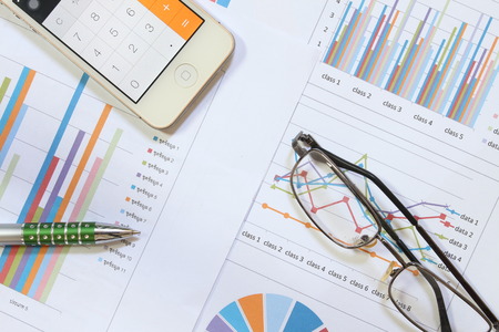 Bar charts and pen as accounting or business conceptの写真素材