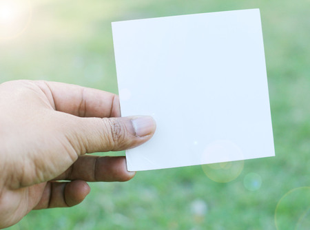 Empty paper sheet in a handの写真素材