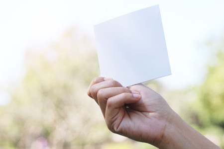 Empty paper sheet in a handの写真素材