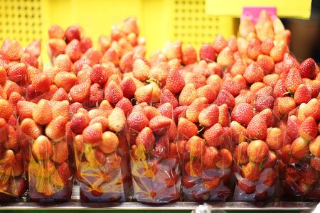 Strawberries are on sale at the market.の写真素材