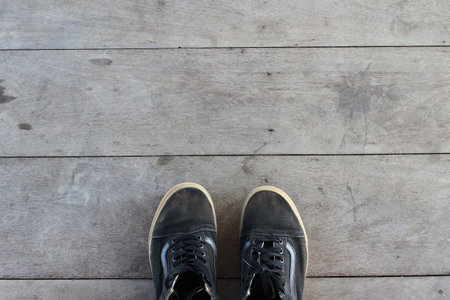 Selfie of shoes on wooden floor background, Top view with copy space