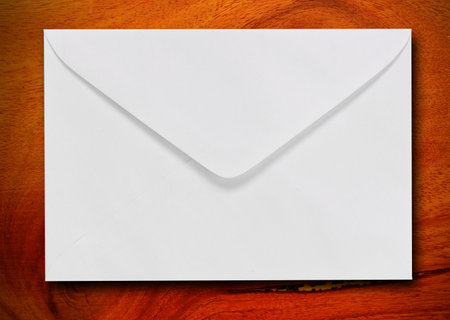 White envelope on wood background with copy space for add text or messageの写真素材
