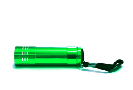 Green flashlight isolated on white background with clipping path and copy space.の写真素材