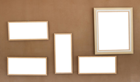blank picture frame on brown wall, can be used for montage or display your productsの写真素材