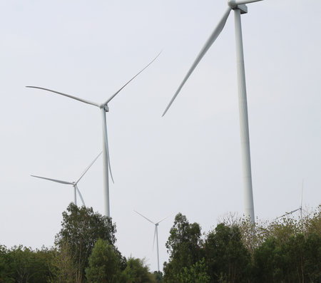 Wind turbines in the field, closeup of photo with soft focus