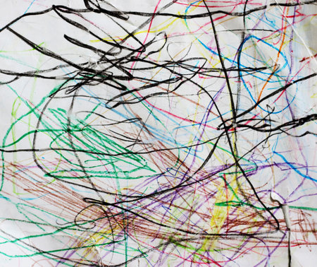 Abstract background with colorful scribbles on a white sheet of paper.の写真素材