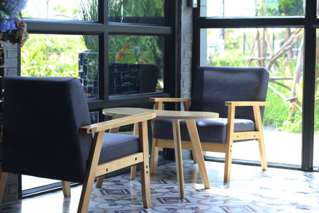 Wooden table and chairs in coffee shop, stock photo for designの写真素材