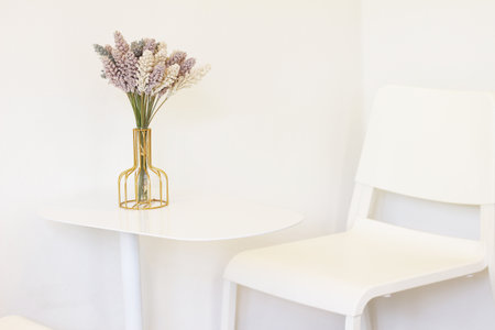 Vase flower decoration on table in living room interior - Vintage Light Filter