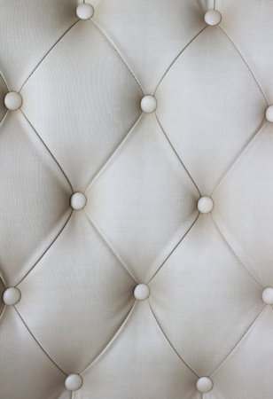 Luxury white leather upholstery sofa texture for background.