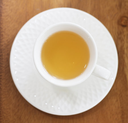 A cup of tea on a wooden table. Top view, flat layの写真素材