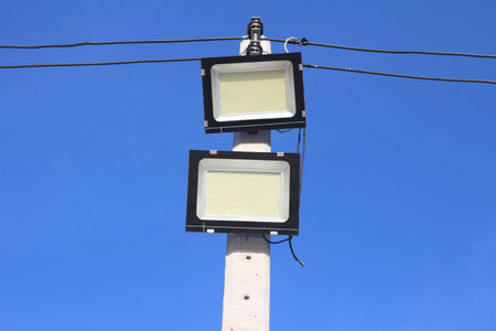 LED light pole with blue sky background, close-up of photo