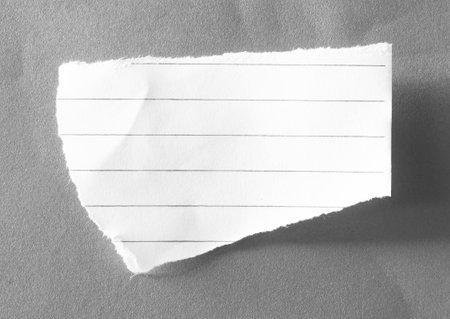 Torn paper with space for your message or text on grey backgroundの写真素材