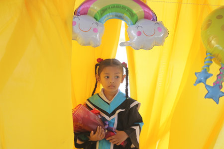 Unidentified Thai students 4 - 8 years old in ceremony uniform during sport parade in Bangkok,...