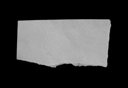 Green torn paper with space for your message or text on black backgroundの写真素材