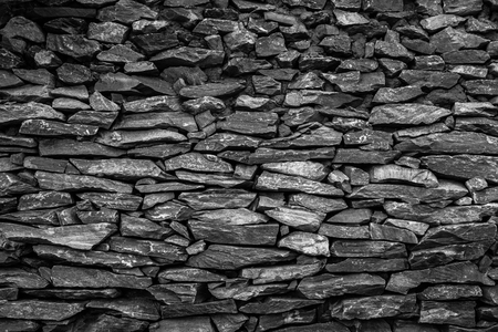 Stone wall of sandstone with very good detail blackの写真素材