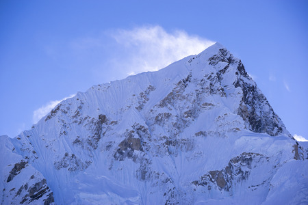 closed up view of Lhotse peak with snow blowing on top from Gorak Shep. During the way to Everest base camp. Sagarmatha national park. Nepal.の写真素材