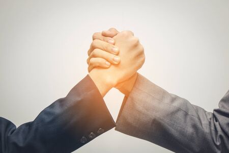 two businessman holding hands during a meeting, success, dealing
