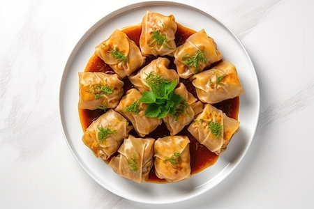 Top View Vegan Cabbage Rolls On White Round Plate On White Backgroundの素材
