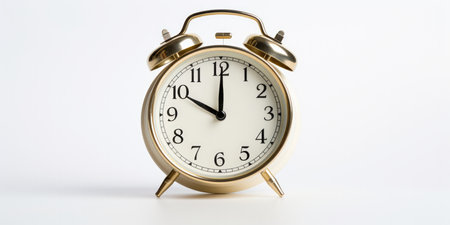 Precise Timing An Alarm Clock Isolated Against A White Background Showing The Exact Time With Accuracy And Precision.の素材