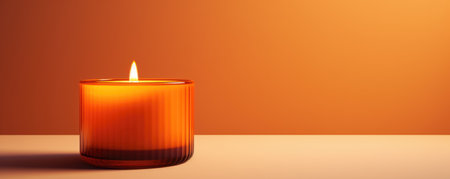 An Amber Candle Emitting A Warm Glow.の素材